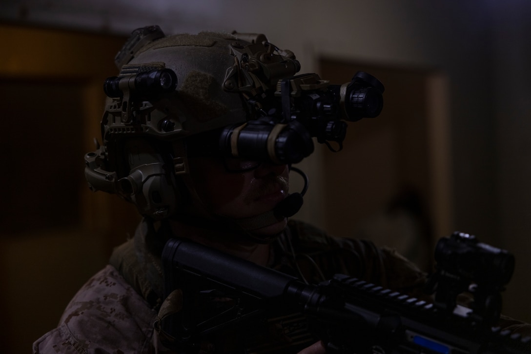 A U.S. Marine with 3rd Force Reconnaissance Company, 4th Marine Division, holds security in a hallway in a house while participating in a nighttime raid with partner forces during exercise UNITAS 2025 Marine Corps Base Camp Lejeune, North Carolina, Sept. 23, 2025. UNITAS, which is Latin for “unity,” was conceived in 1959 and has taken place annually since first conducted in 1960. This year marks the 66th iteration of the world’s longest running annual multinational maritime exercise. (U.S. Marine Corps photo by Lance Cpl. Payton Goodrich)