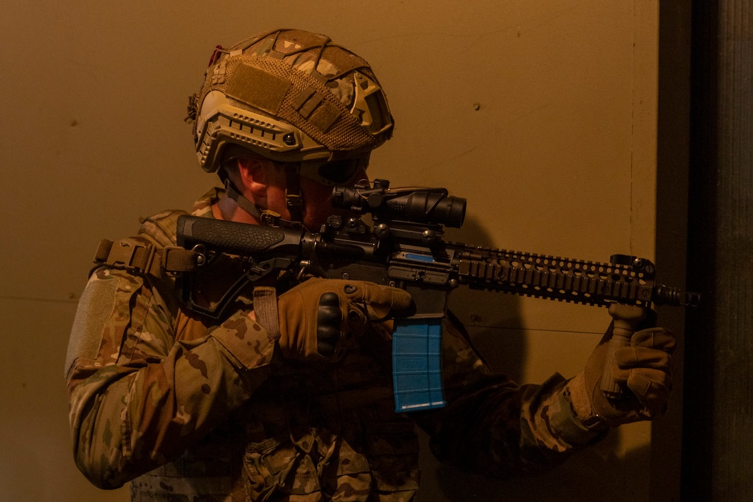 A marine with Infantería de Marina de la Armada de la República Argentina (Argentine marines), holds security from a second story window during a nighttime raid with partner forces during exercise UNITAS 2025 Marine Corps Base Camp Lejeune, North Carolina, Sept. 23, 2025. UNITAS, which is Latin for “unity,” was conceived in 1959 and has taken place annually since first conducted in 1960. This year marks the 66th iteration of the world’s longest running annual multinational maritime exercise. (U.S. Marine Corps photo by Lance Cpl. Payton Goodrich)