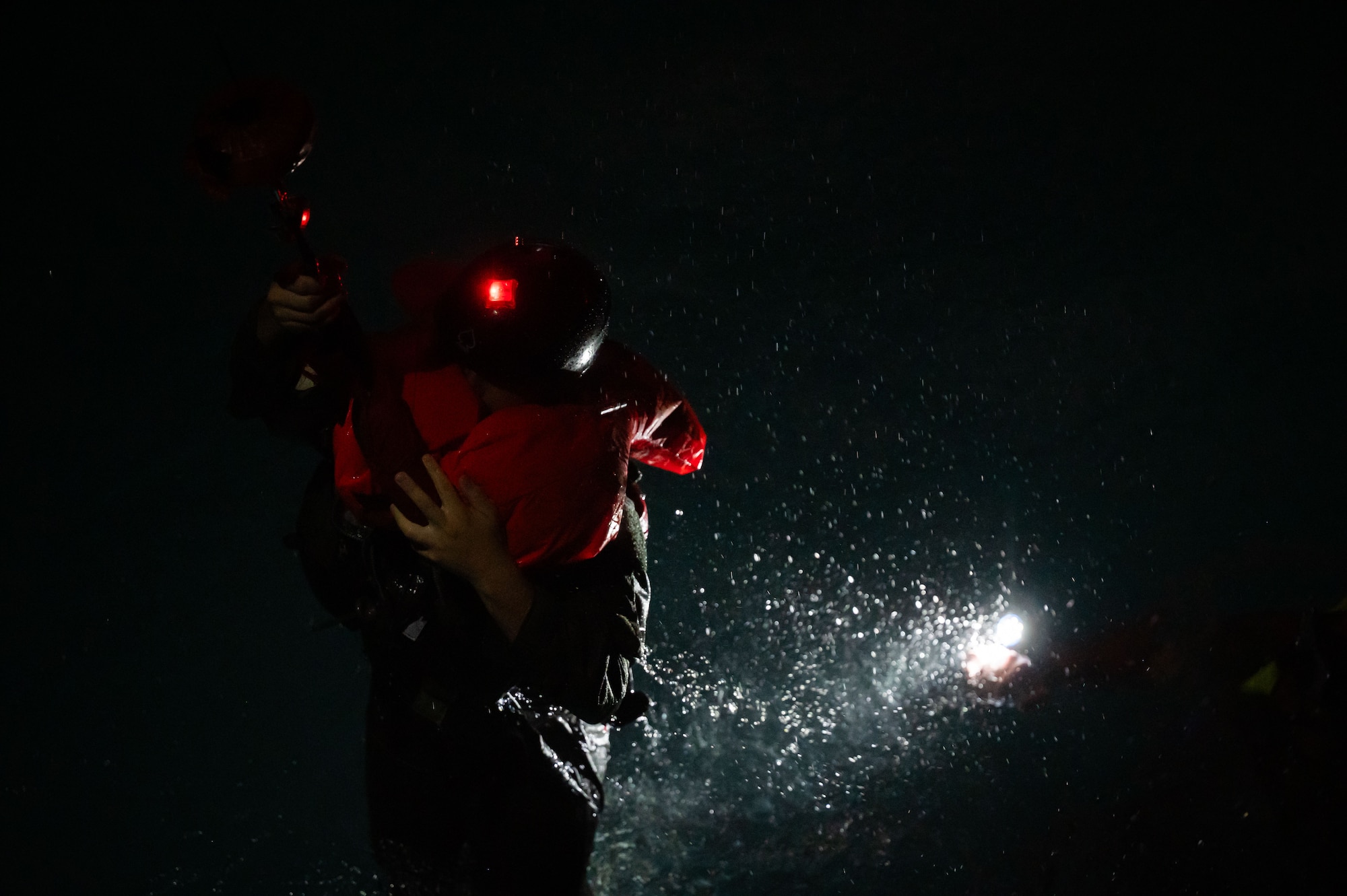 An Airman assigned to the 100th Air Refueling Wing is pulled out of a pool during the Survival, Evasion, Resistance, and Escape course at the East Coast Environmental Pool, Lowestoft, United Kingdom, Sept. 12, 2025.