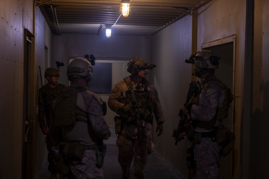 U.S. Marines with 3rd Force Reconnaissance Company, 4th Marine Division, clear a house while participating in a nighttime raid during exercise UNITAS 2025 Marine Corps Base Camp Lejeune, North Carolina, Sept. 23, 2025. UNITAS, which is Latin for “unity,” was conceived in 1959 and has taken place annually since first conducted in 1960. This year marks the 66th iteration of the world’s longest running annual multinational maritime exercise. (U.S. Marine Corps photo by Lance Cpl. Payton Goodrich)
