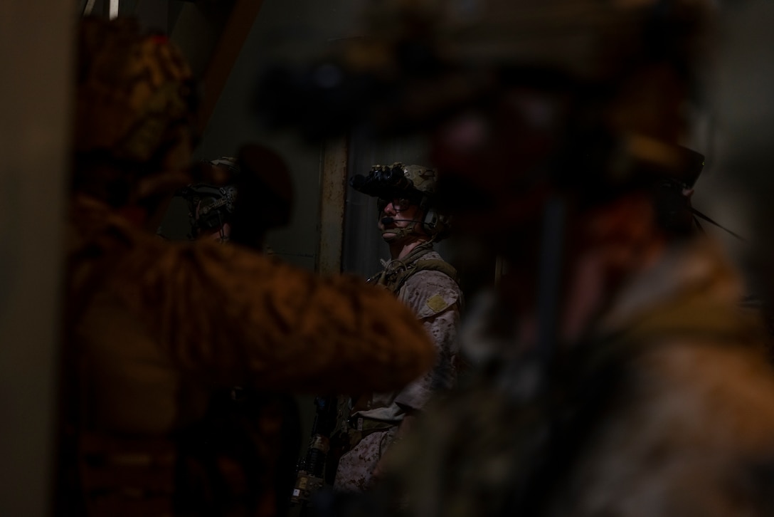 U.S. Marines with 3rd Force Reconnaissance Company, 4th Marine Division, Infantería de Marina del Perú (Peruvian naval infantry), Infantería de Marina de la Armada de la República Argentina (Argentine marines), and Cuerpo de Infantería de Marina (Mexican marine corps), clear a house while participating in a nighttime raid with partner forces during exercise UNITAS 2025 Marine Corps Base Camp Lejeune, North Carolina, Sept. 23, 2025. UNITAS, which is Latin for “unity,” was conceived in 1959 and has taken place annually since first conducted in 1960. This year marks the 66th iteration of the world’s longest running annual multinational maritime exercise. (U.S. Marine Corps photo by Lance Cpl. Payton Goodrich)