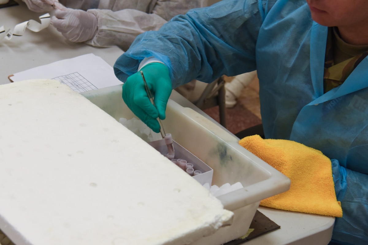 Image of an Airman working with samples.