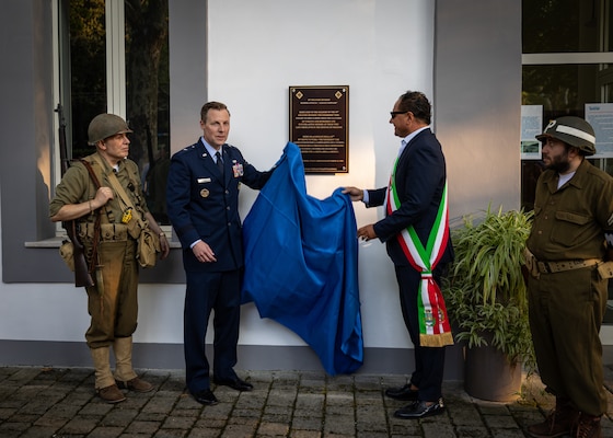 Brig. Gen. Christopher Eason, chief of staff, Oklahoma Air National Guard (left) and Giovanni Caporaso, mayor of Telese Terme, Italy, unveil a plaque dedicated to the 45th Infantry Division at the Telese Bath Complex, Sept. 6, 2025. A delegation of Oklahoma National Guard members and veterans toured key locations from the 45th Infantry Division’s campaign in Italy against German forces during World War II, continuing the development of the Thunderbird Trail. The initiative is aimed at preserving the Division's role in World War II through a memorial trail tracing its footsteps through Italy, France and Germany, ensuring their sacrifices are never forgotten. (U.S. Army photo by Sgt. Danielle Rayon)