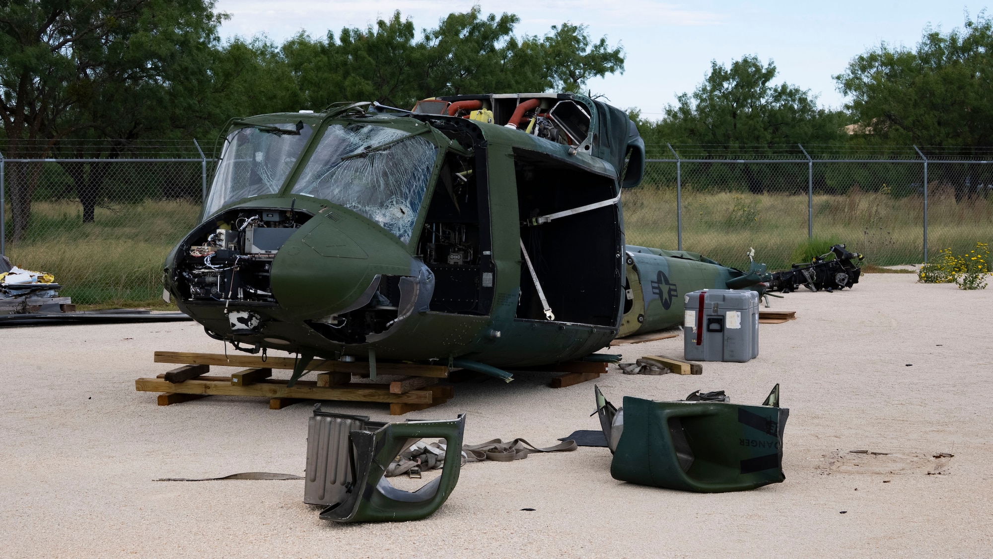 A UH-1 Iroquois helicopter sits at the 436th Training Squadron’s Aircraft Mishap Investigation Course Crash Lab at Dyess Air Force Base, Texas, September 23, 2025. The aircraft was retrieved from Cheyenne Air National Guard Base, Wyoming, on September 17, 2025, for use by Aircraft Mishap Investigation Course instructors. (U.S. Air Force photo by Staff Sgt. Tyrell Hall)