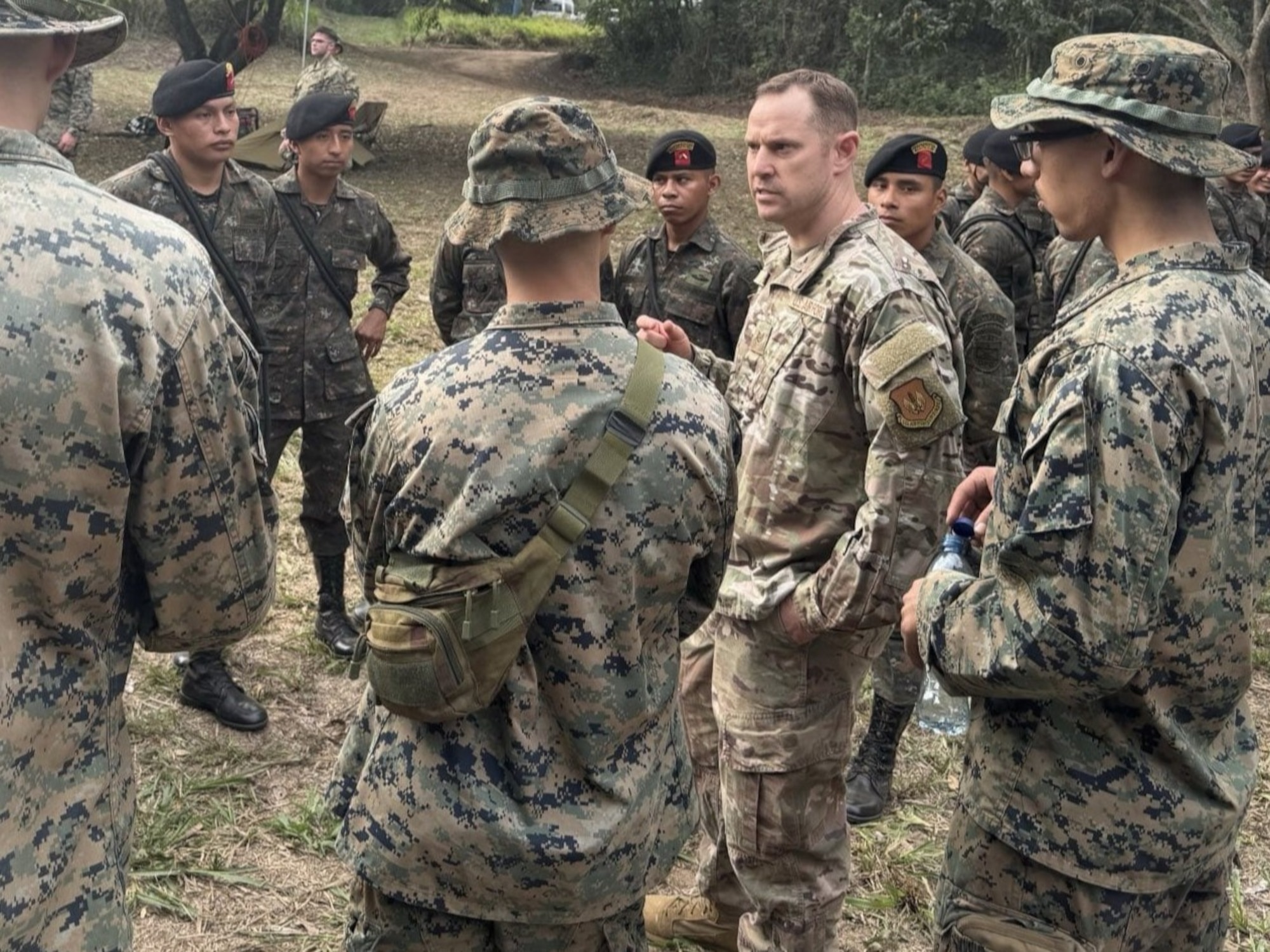 U.S. Air Force Tech Sgt. Mark Fain interprets for members of the 1st Battalion, 25th Marines and Guatemalan paratroops, known as Paracaidistas, on May 16, 2025, at a training base near here during CENTAM Guardian 2025. CENTAM Guardian, an annual, multinational exercise, fosters strong partnerships by enabling combined forces to effectively address shared security challenges. The Air Force’s Language Enabled Airman Program, of which Fain is a member, includes more than 3,700 service members who bridge language and cultural barriers with allies and partners to create a more interoperable, lethal force. (Courtesy photo by U.S. Air Force Master Sgt. Elio De Los Santos)