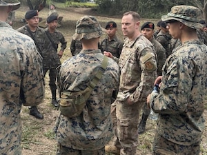 U.S. Air Force Tech Sgt. Mark Fain interprets for members of the 1st Battalion, 25th Marines and Guatemalan paratroops, known as Paracaidistas, on May 16, 2025, at a training base near here during CENTAM Guardian 2025. CENTAM Guardian, an annual, multinational exercise, fosters strong partnerships by enabling combined forces to effectively address shared security challenges. The Air Force’s Language Enabled Airman Program, of which Fain is a member, includes more than 3,700 service members who bridge language and cultural barriers with allies and partners to create a more interoperable, lethal force. (Courtesy photo by U.S. Air Force Master Sgt. Elio De Los Santos)