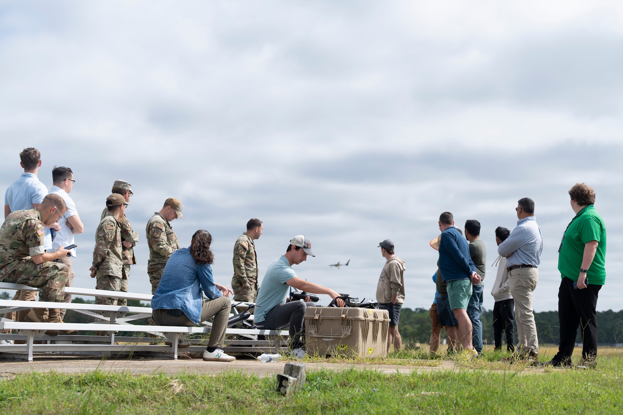 Participants of the Hackathon 25.4 at observe a drone flight at Poinsett Electronic Combat Range, Sumter, S.C.,  Sept 10, 2025. The four-day Hackathon welcomed participants and observers alike, centering on five key challenges, each addressing real-world operational use cases. Participants developed cutting-edge solutions, culminating in final judging and awards. (U.S. Air Force photo by Staff Sgt. Moses Taylor)