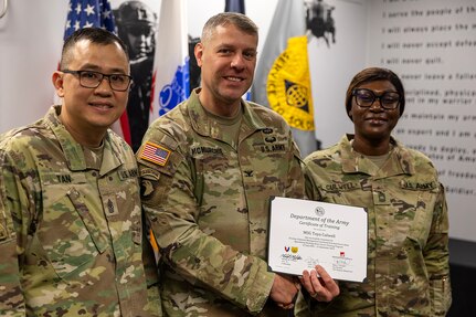 Col. Shaun D. McMurchie, 45th Finance Center director, and Sgt. Maj. Rodani O. Tan, 45th FC senior enlisted advisor, present Master Sgt. Toya Culwell, Georgia Army National Guard 93rd Finance Battalion senior enlisted advisor, with a corticate of training upon completion of the U.S. Army Financial Management Command’s Operational Banking Short Course at the Maj. Gen. Emmett J. Bean Federal Center in Indianapolis Sept. 12, 2025. Upon graduation of the OBSC, Soldiers can advise commanders on establishing financial institutions and ATMs on Army installations, evaluate foreign financial institutions for establishing limited depositary accounts, and provide banking infrastructure evaluations as part of an economic analysis. (U.S. Army photo by Mark R. W. Orders-Woempner)