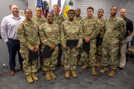 Class 03-25 of the U.S. Army Financial Management Command’s Operational Banking Short Course pose for a photo with USAFMCOM and 45th Finance Center leaders at the Maj. Gen. Emmett J. Bean Federal Center Sept. 12, 2025. Pictured left to right are: Shawn Crocker, USAFMCOM Department of the Army deputy banking officer; Capt. Kali Rose, 125th Finance Battalion disbursing officer; Sgt. Maj. Rodani O. Tan, 45th FC senior enlisted advisor; Capt. Hydeia Pickett, 15th FIBN disbursing officer; Col. Shaun D. McMurchie, 45th FC director; Master Sgt. Toya Culwell, 93rd Finance Battalion senior enlisted advisor; Capt. Marcques Walker, 1128th Finance Company disbursing officer; 1st Lt. Jonathan Padilla, 125th FIBN deputy disbursing officer; Capt. Jasmine Thompson, USAFMCOM Department of the Army banking officer; Maj. Terrell Murdock, USAFMCOM executive officer; and Chad Samsel, USAFMCOM eCommerce and Banking director. (U.S. Army photo by Mark R. W. Orders-Woempner)
