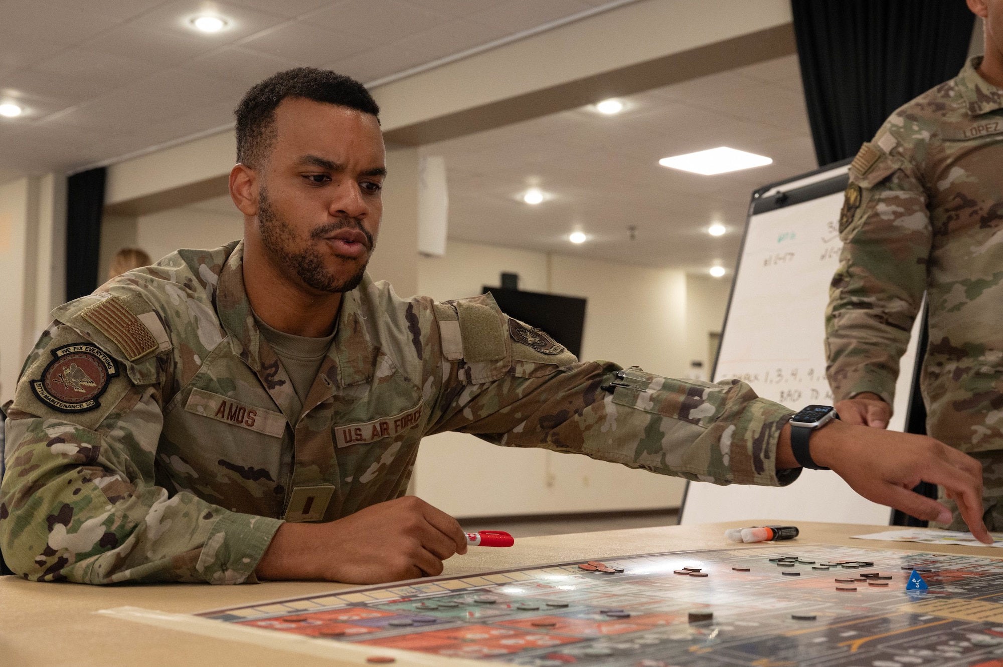 U.S. Air Force 2nd Lt. Matthew Amos, 317th Maintenance Squadron accessories flight commander, plans his next move during KingFish Agile Combat Employment board wargame exercise at Dyess Air Force Base, Texas, Sept. 16, 2025. Kingfish ACE is a strategy game that centers around a hypothetical scenario set in the Western Pacific where players are tasked with employing forces to generate air power while overcoming the game’s various challenges and obstacles. (U.S. Air Force photo by Airman William Neal)