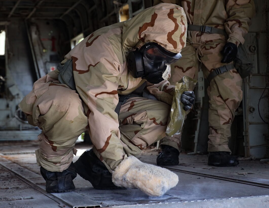 U.S. Marine Corps Lance Cpl. Madison Furlong, a chemical, biological, radiological, and nuclear (CBRN) defense specialist with Marine Wing Support Squadron (MWSS) 174, Marine Aircraft Group 24, 1st Marine Aircraft Wing, uses M100 Sorbent Decontamination System to decontaminate an aircraft during exercise Toxic Swell 25 at Marine Corps Training Area Bellows, Hawaii, Aug. 20, 2025. Toxic Swell 25 is a joint CBRN exercise hosted by MWSS-174, that provided mission essential training as well as enhanced joint interoperability between the U.S. Marine Corps, Air National Guard, U.S. Air Force, U.S. Air Force Reserves and partnered nations. (U.S. Marine Corps photo by Cpl. Anabelle Reed-O’Brien)