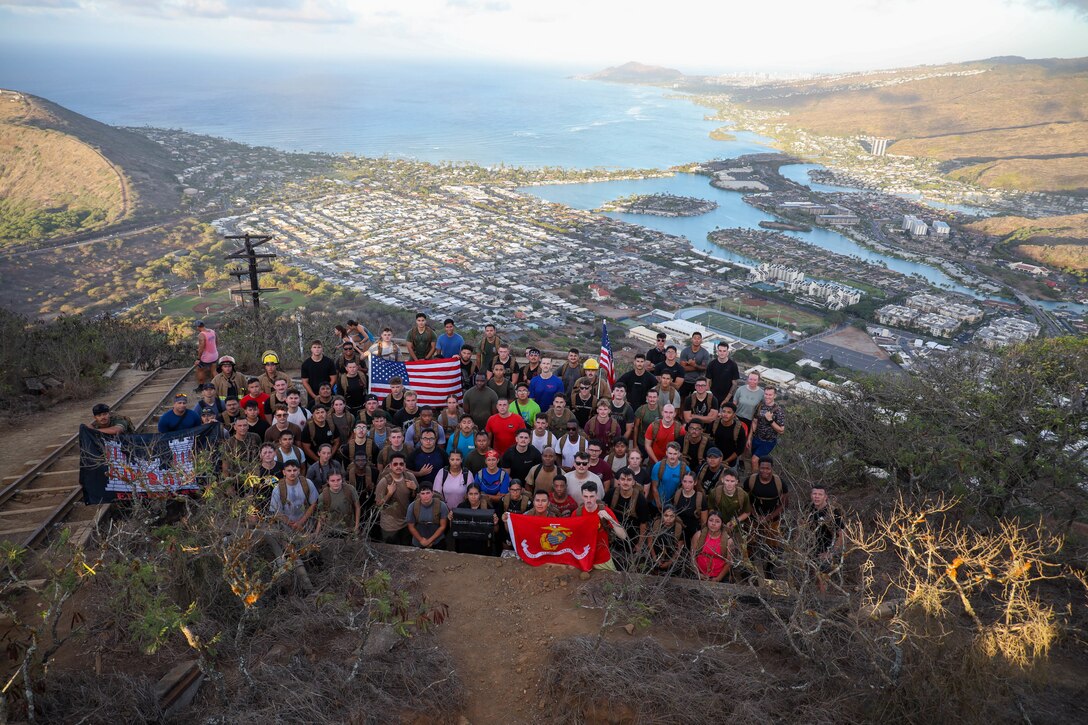 U.S. Marines with Marine Aircraft Group (MAG) 24, 1st Marine Aircraft Wing pose for a group photo after climbing Koko Crater Trail at Honolulu, Hawaii, Sept. 11, 2025. MAG-24's Non-Commissioned Officers completed a hike up Koko Crater Trail to honor the firefighters who bravely ascended the Twin Towers on Sept. 11, 2001, remembering the nearly 3,000 lives lost and embodying the spirit of sacrifice, leadership and resilience. (U.S. Marine Corps photo by Staff Sgt. Heather Atherton)
