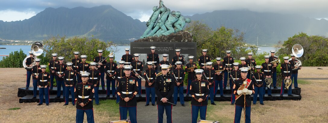 U.S. Marines with the U.S. Marine Corps Forces Pacific Band pose for a unit photo in front of the Iwo Jima Memorial on Marine Corps Base Hawaii, Aug. 25, 2025. The MARFORPAC Band performs throughout the Indo-Pacific at more than 400 events each year, including ceremonies and parades. The band’s primary mission is to provide musical support for military and civic ceremonies. (U.S. Marine Corps photo by Cpl. Conor Ragland)