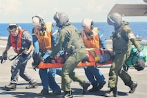 Service members and medical professionals from Japan, Republic of Korea, and U.S. forces conduct a medical evacuation training exercise in support of Freedom Edge 25.