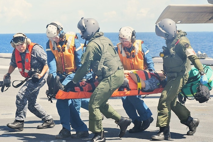 Service members and medical professionals from Japan, Republic of Korea, and U.S. forces conduct a medical evacuation training exercise in support of Freedom Edge 25.