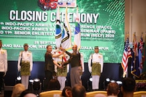 U.S. Army Gen. Ronald P. Clark, U.S. Army Pacific Commander and Malaysian Army Gen. Muhammad Hafizuddeain, Chief of the Malaysian Army pass the colors during the closing ceremony of the 14th Indo-Pacific Armies Chiefs Conference (IPACC), the 49th Indo-Pacific Army Management Seminar (IPAMS), and the 11th Senior Enlisted Leaders Forum (SELF), held in Kuala Lumpur, Malaysia, September 25, 2025.