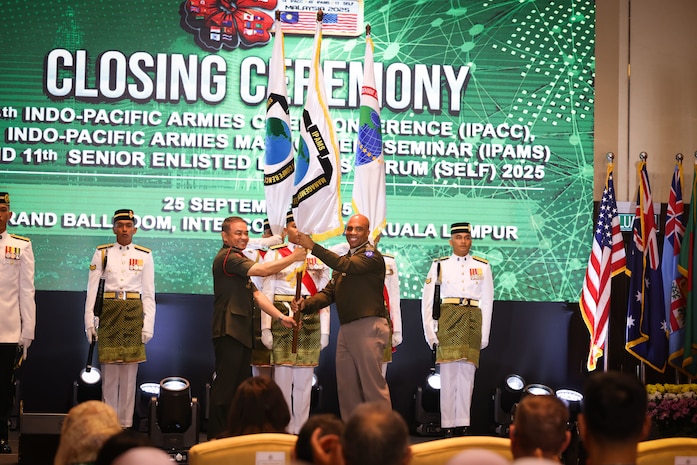 U.S. Army Gen. Ronald P. Clark, U.S. Army Pacific Commander and Malaysian Army Gen. Muhammad Hafizuddeain, Chief of the Malaysian Army pass the colors during the closing ceremony of the 14th Indo-Pacific Armies Chiefs Conference (IPACC), the 49th Indo-Pacific Army Management Seminar (IPAMS), and the 11th Senior Enlisted Leaders Forum (SELF), held in Kuala Lumpur, Malaysia, September 25, 2025.
