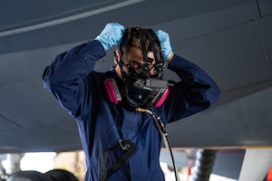U.S. Air Force Airman 1st Class William Brice, 100th Maintenance Squadron, dons an Integrated Respirator Information System at RAF Mildenhall, England, Sept. 2, 2025.