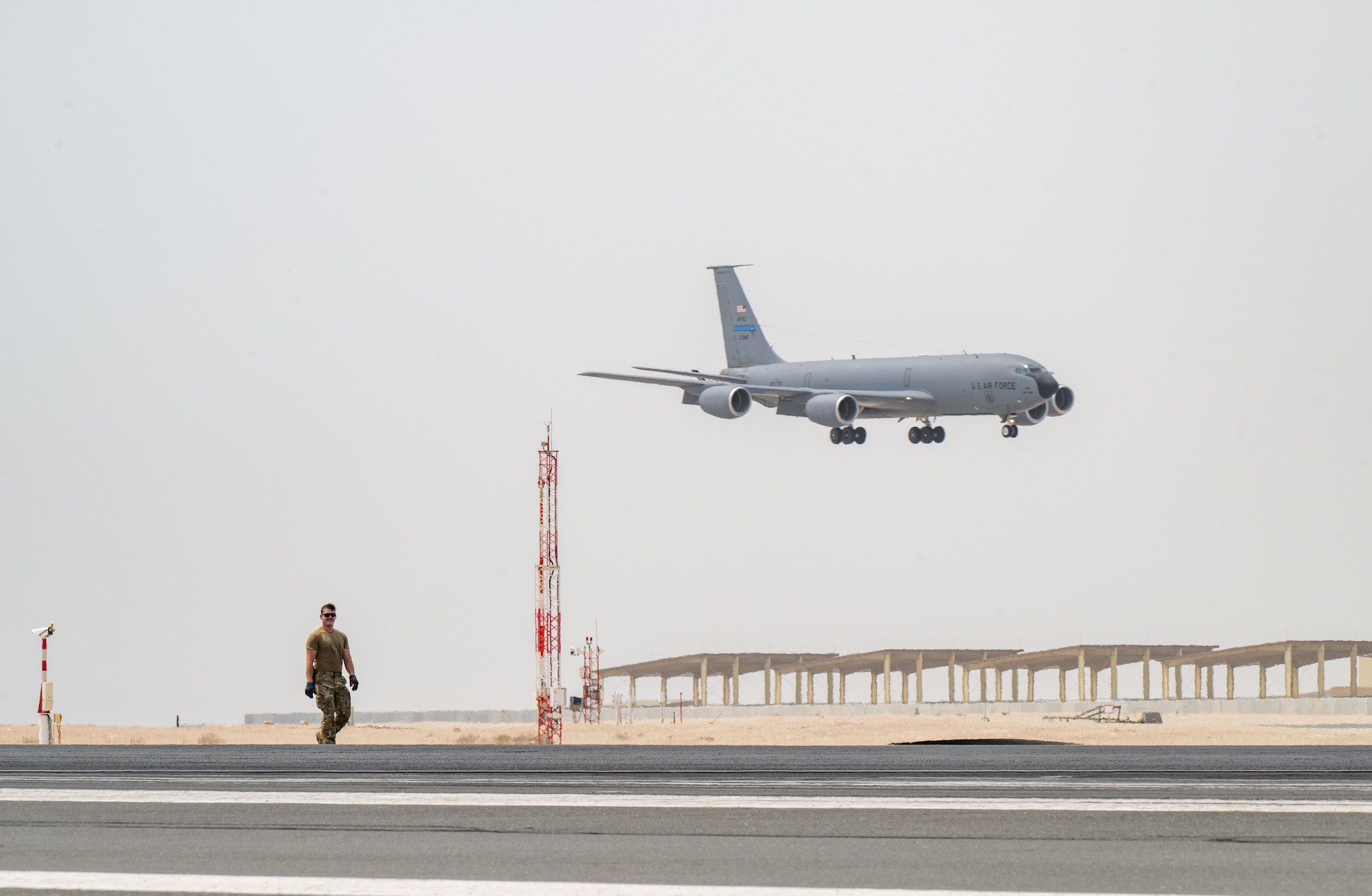 U.S. Air Force Senior Airman Nathan Baer, 379th Expeditionary Civil Engineer Squadron firefighter, walks the flightline after conducting an arresting system test within the U.S. Central Command area of responsibility, Sept. 14, 2025. The aircraft arresting system test provided the 379th ECES Fire and Emergency Services team with an opportunity to sharpen their skills and prepare for aircraft emergencies. (U.S. Air Force photo by Senior Airman Amanda Jett)