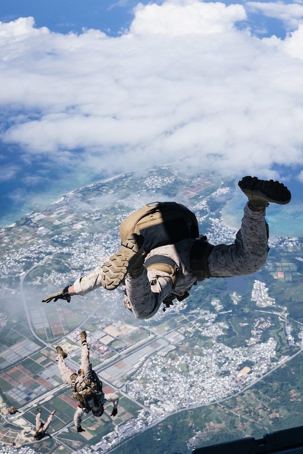 U.S. Marines with Force Reconnaissance Platoon, Maritime Raid Force, 31st Marine Expeditionary Unit, conduct a freefall jump during parachute operations training over Okinawa, Japan, Sep. 26, 2025. The Marines conducted the training to maintain and improve their parachute insertion skills. The 31st MEU, the Marine Corps’ only continuously forward-deployed MEU, provides a flexible and lethal force ready to perform a wide range of military operations as the premiere crisis response force in the Indo-Pacific region. (U.S. Marine Corps photo by Cpl. Alora Finigan)