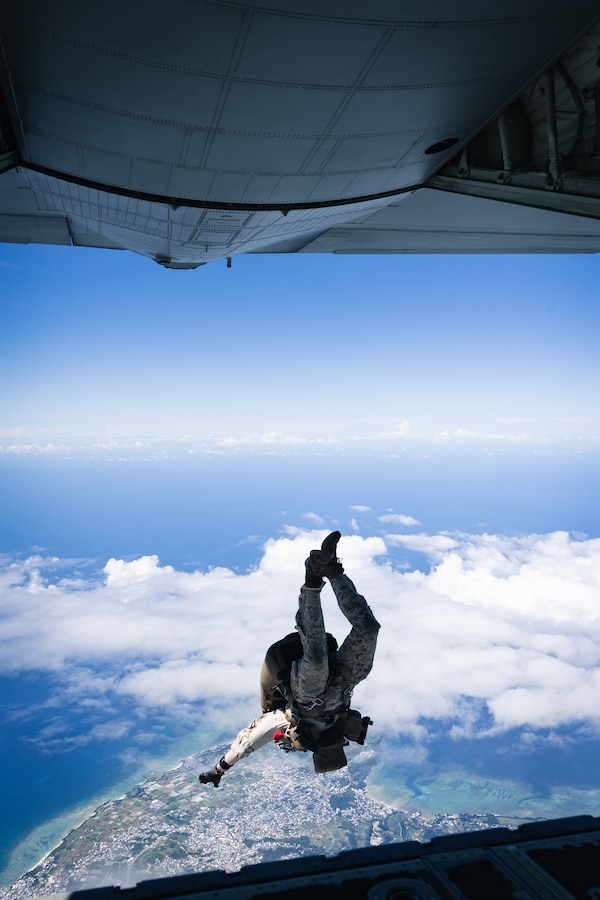 A U.S. Marine with Force Reconnaissance Platoon, Maritime Raid Force, 31st Marine Expeditionary Unit, conducts a freefall jump during parachute operations training over Okinawa, Japan, Sep. 26, 2025. The Marines conducted the training to maintain and improve their parachute insertion skills. The 31st MEU, the Marine Corps’ only continuously forward-deployed MEU, provides a flexible and lethal force ready to perform a wide range of military operations as the premiere crisis response force in the Indo-Pacific region. (U.S. Marine Corps photo by Cpl. Alora Finigan)