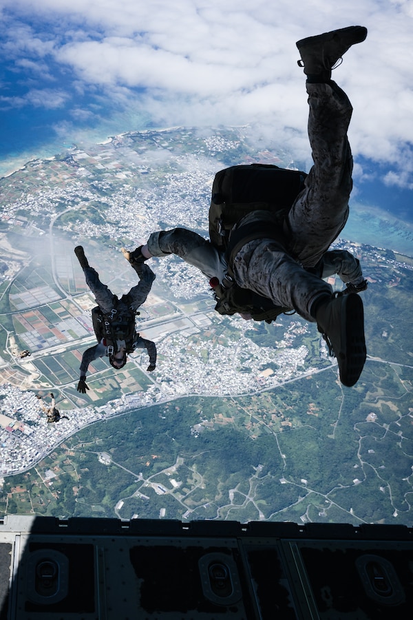 U.S. Marines with Force Reconnaissance Platoon, Maritime Raid Force, 31st Marine Expeditionary Unit, conduct a freefall jump during parachute operations training over Okinawa, Japan, Sep. 26, 2025. The Marines conducted the training to maintain and improve their parachute insertion skills. The 31st MEU, the Marine Corps’ only continuously forward-deployed MEU, provides a flexible and lethal force ready to perform a wide range of military operations as the premiere crisis response force in the Indo-Pacific region. (U.S. Marine Corps photo by Cpl. Alora Finigan)