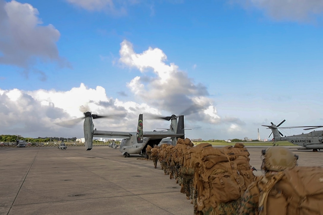 U.S. Marines with Battalion Landing Team 1st Battalion, 7th Marine Regiment, 31st Marine Expeditionary Unit, load onto a U.S. Marine Corps MV-22B Osprey assigned to Marine Medium Tiltrotor Squadron (VMM) 265 (Rein.), during flight operations at Marine Corps Air Station Futenma, Okinawa, Japan, Sept. 26, 2025. The Marines conducted flight operations demonstrating multi-domain transport capabilities of the 31st MEU. The 31st MEU, the Marine Corps’ only continuously forward-deployed MEU, provides a flexible and lethal force, ready to perform a wide range of military operations as the premiere crisis response force in the Indo-Pacific region. (U.S. Marine Corps photo by Lance Cpl. Skilah Sanchez)