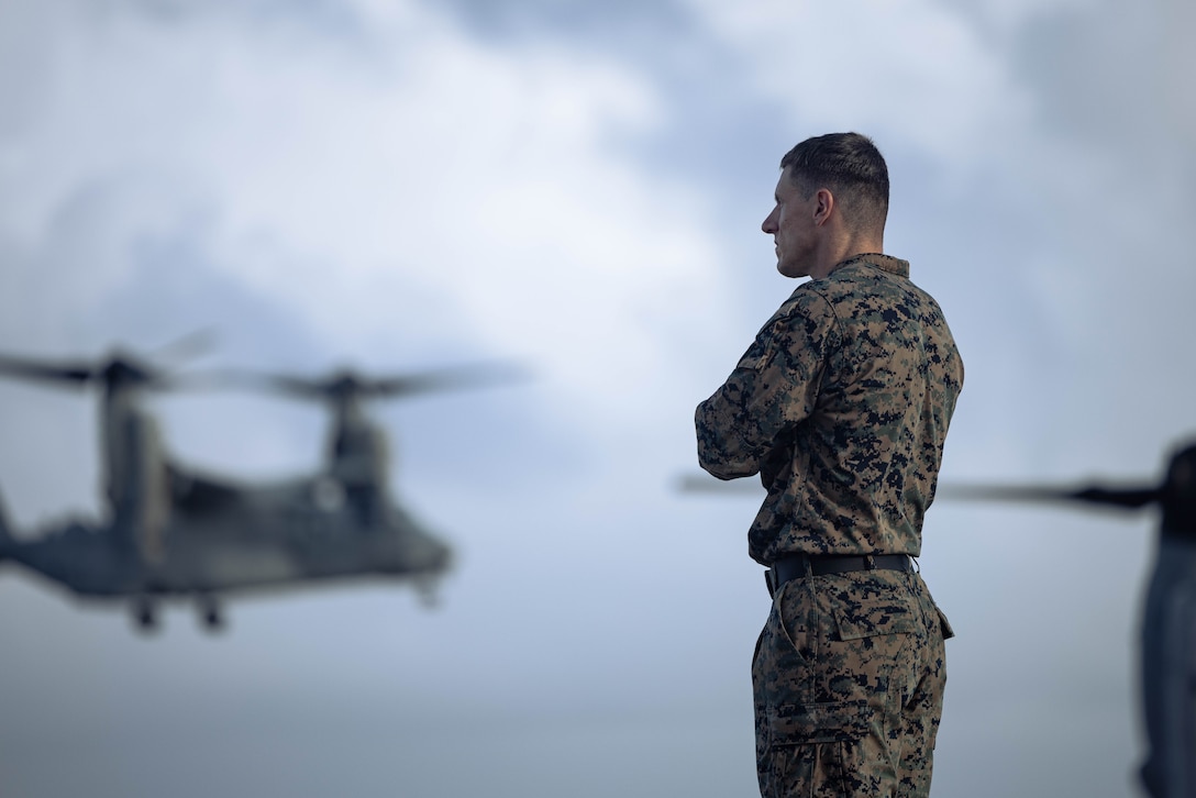 U.S. Marine Corps Lt. Col. Andrew P. Hornfeck, the commanding officer of Battalion Landing Team 1st Battalion, 7th Marine Regiment, 31st Marine Expeditionary Unit, observes flight operations at Marine Corps Air Station Futenma, Okinawa, Japan, Sept. 26, 2025. The Marines conducted flight operations demonstrating multi-domain transport capabilities to support combined-joint all domain operations. The 31st MEU, the Marine Corps’ only continuously forward-deployed MEU, provides a flexible and lethal force, ready to perform a wide range of military operations as the premiere crisis response force in the Indo-Pacific region. (U.S. Marine Corps photo by Sgt. Angel Diaz Montes De Oca)