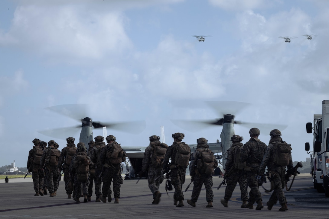 U.S. Marines with Battalion Landing Team 1st Battalion, 7th Marine Regiment, 31st Marine Expeditionary Unit, load onto a U.S. Marine Corps MV-22B Osprey assigned to Marine Medium Tiltrotor Squadron (VMM) 265 (Rein.), 31st MEU, during flight operations at Marine Corps Air Station Futenma, Okinawa, Japan, Sept. 26, 2025. The Marines conducted flight operations demonstrating multi-domain transport capabilities to support combined-joint all domain operations. The 31st MEU, the Marine Corps’ only continuously forward-deployed MEU, provides a flexible and lethal force, ready to perform a wide range of military operations as the premiere crisis response force in the Indo-Pacific region. (U.S. Marine Corps photo by Sgt. Angel Diaz Montes De Oca)