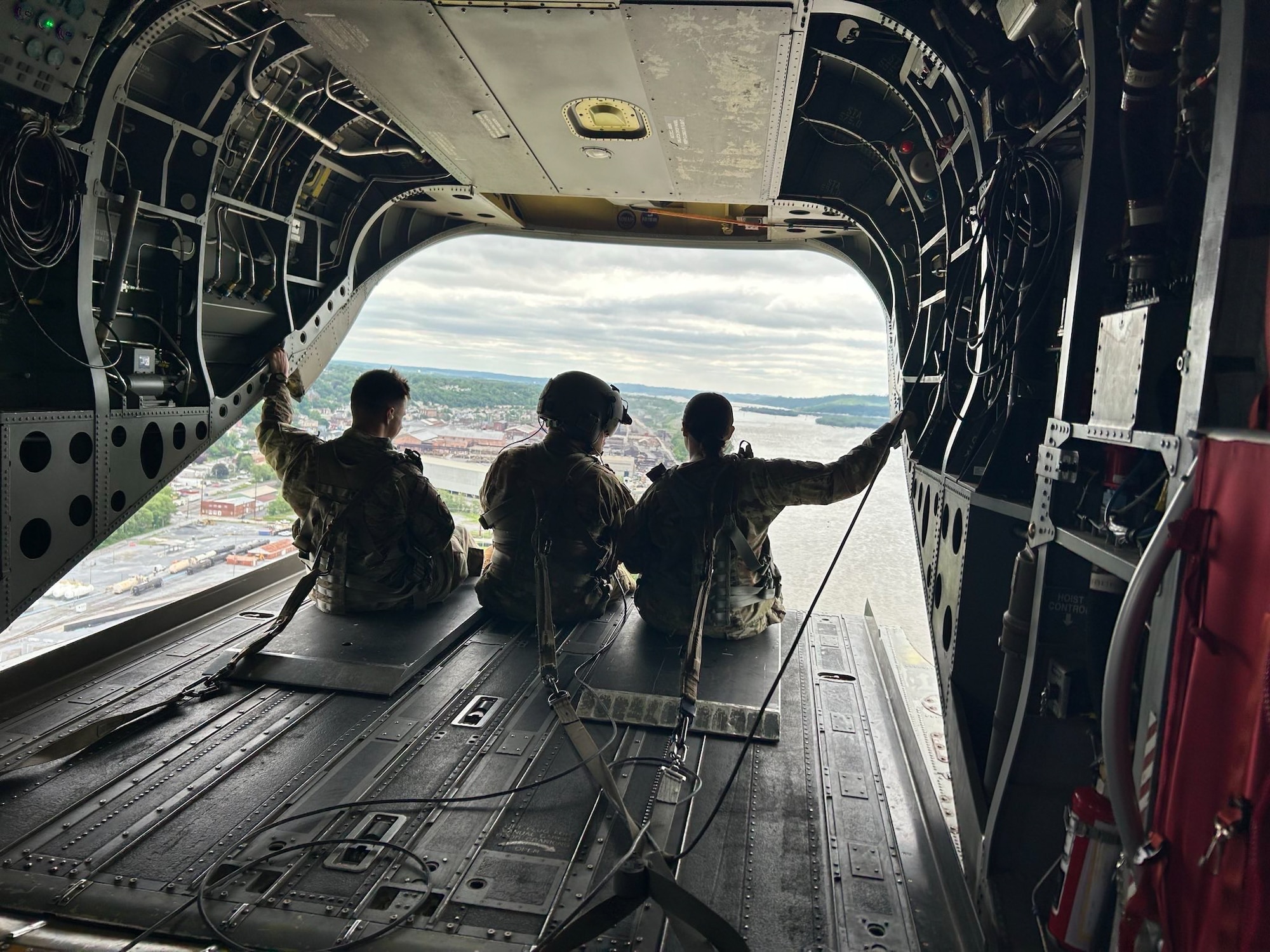 Airmen from the Kentucky Air National Guard’s 123rd Mission Support Group support Exercise Kentucky Windage 2025 aboard a CH-47 Chinook helicopter over Fort Indiantown Gap, Pa., May 22, 2025. Nearly 70 Airmen deployed for the field exercise to strengthen their Agile Combat Employment skills. (U.S. Air National Guard photo by Master Sgt. Kenneth Soto)