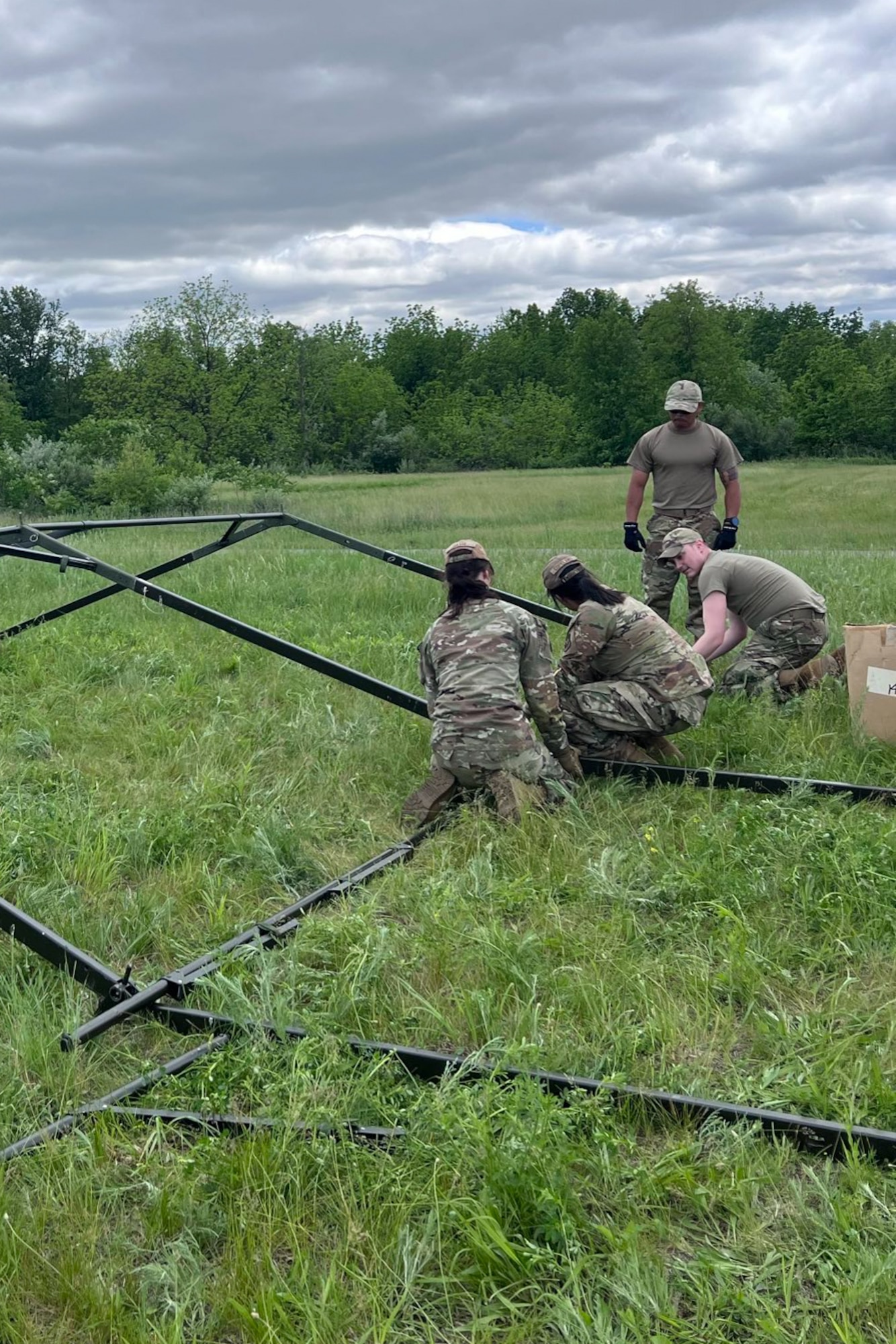Airmen from the Kentucky Air National Guard’s 123rd Mission Support Group erect tent frames in Indiantown Gap, Pa., May 22, 2025, as part of Exercise Kentucky Windage 2025. Nearly 70 Airmen deployed for the field exercise to strengthen their Agile Combat Employment skills. (U.S. Air National Guard photo by Master Sgt. Kenneth Soto)