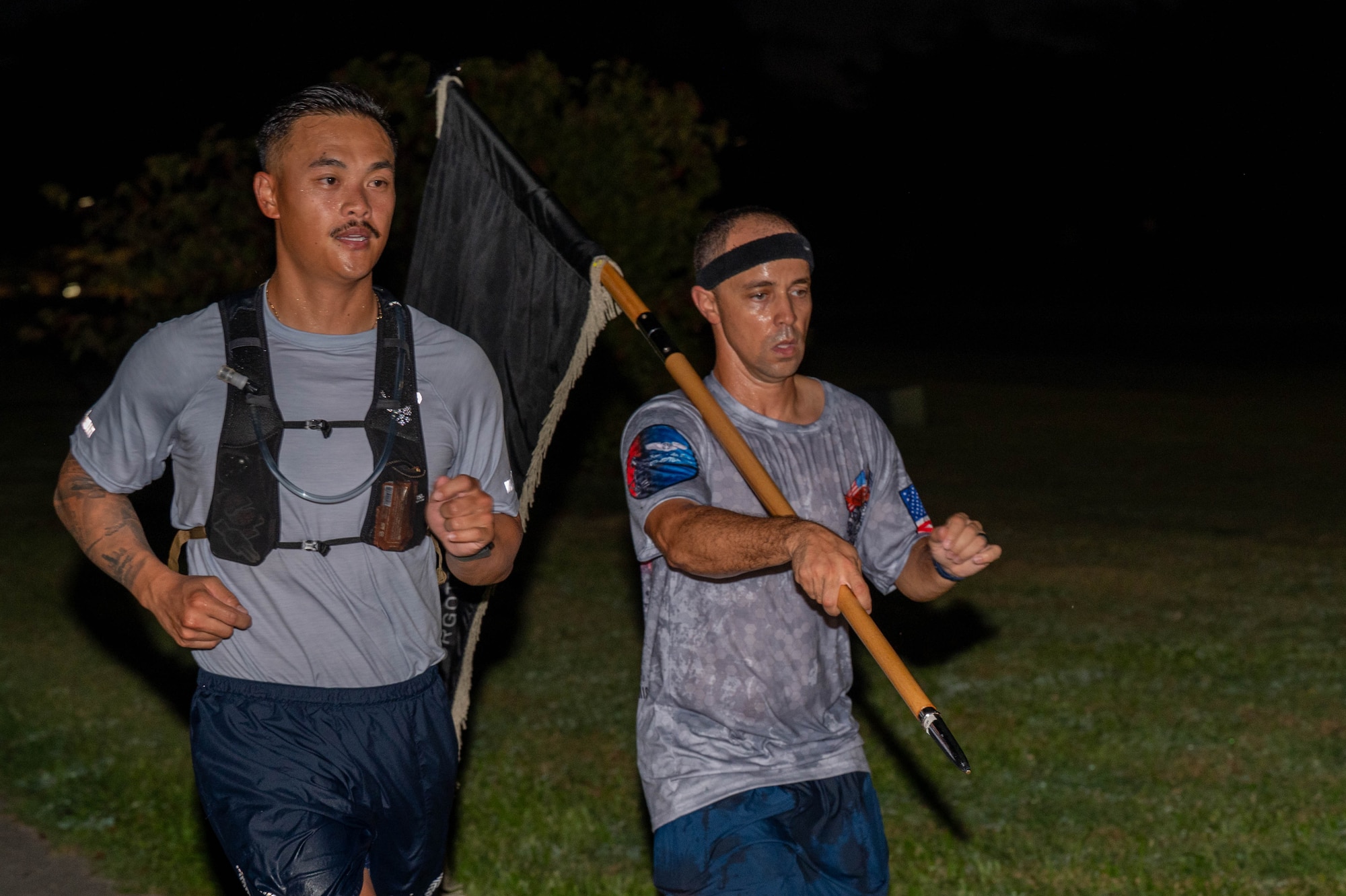 U.S Air Force Airmen assigned to the 18th Wing, participate in the POW-MIA Remembrance Run 24-hour ruck at Kadena Air Base, Japan, Sept. 19, 2025. Service members across Kadena gathered to pay tribute, demonstrating unity while honoring the sacrifice of those who were captured or remain missing in action. (U.S. Air Force photo by Senior Airman Jamal Berry II)