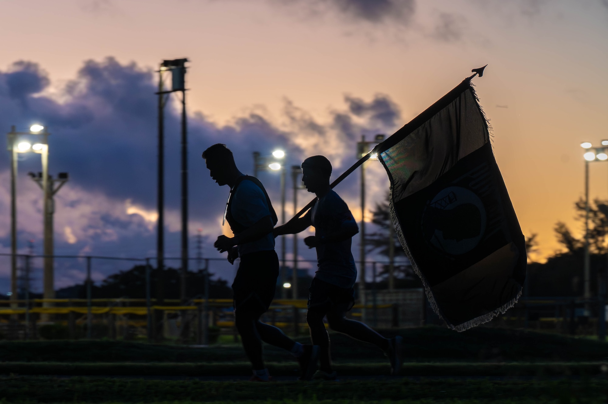 U.S Air Force Airmen assigned to the 18th Wing, participate in the POW-MIA Remembrance Run 24-hour ruck at Kadena Air Base, Japan, Sept. 19, 2025. Service members across Kadena gathered to pay tribute, demonstrating unity while honoring the sacrifice of those who were captured or remain missing in action. (U.S. Air Force photo by Senior Airman Jamal Berry II)