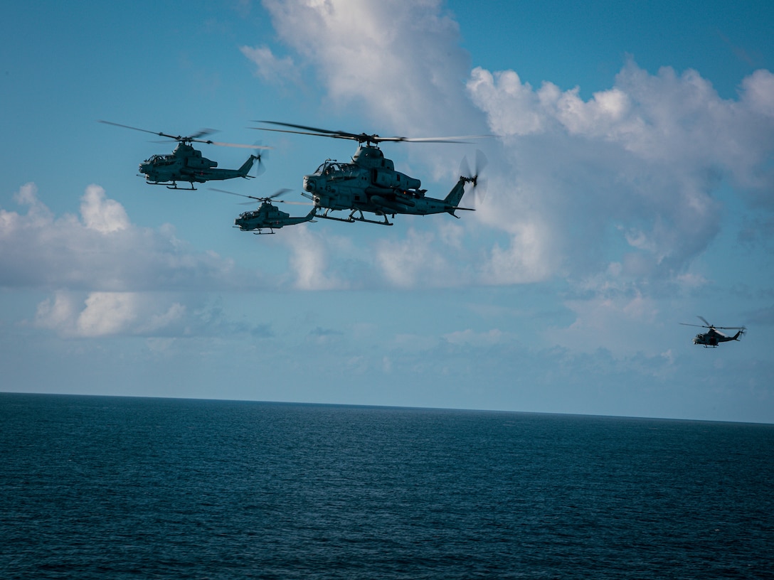 CARIBBEAN SEA – U.S. Marine Corps AH-1Z Viper and UH-1Y Venom helicopters with Marine Medium Tiltrotor Squadron (VMM) 263 (Reinforced), 22nd Marine Expeditionary Unit (Special Operations Capable), fly in a formation during an amphibious operations training in Puerto Rico while underway in the Caribbean Sea, Sept. 5, 2025. U.S. military forces are deployed to the Caribbean in support of the U.S. Southern Command mission, Department of War-directed operations, and the president’s priorities. (U.S. Marine Corps photo by Sgt. Tanner Bernat)
