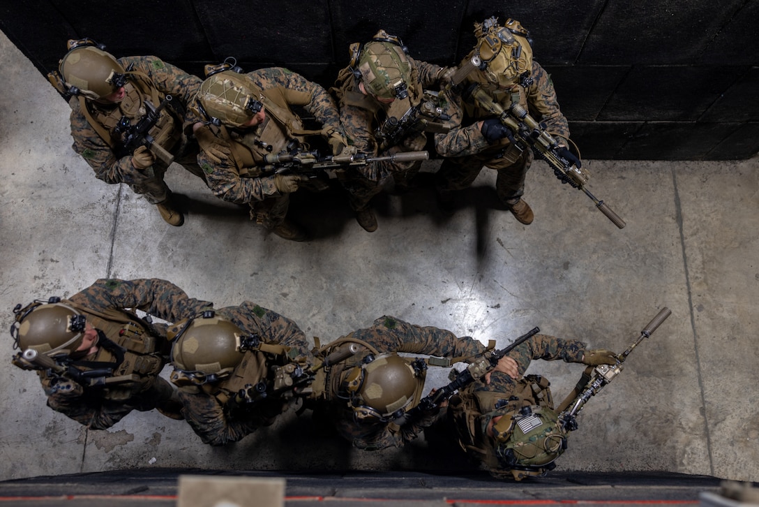 U.S. Marines with India Company, Battalion Landing Team 3/6, 22nd Marine Expeditionary Unit (Special Operations Capable), prepare to clear rooms while conducting close quarters battle training in a shoot house training facility on Camp Santiago, Puerto Rico, September 21, 2025. U.S. military forces are deployed to the Caribbean in support of the U.S. Southern Command mission, Department of War-directed operations, and the president’s priorities. (U.S. Marine Corps photo by Lance Cpl. Kyle Baskin)