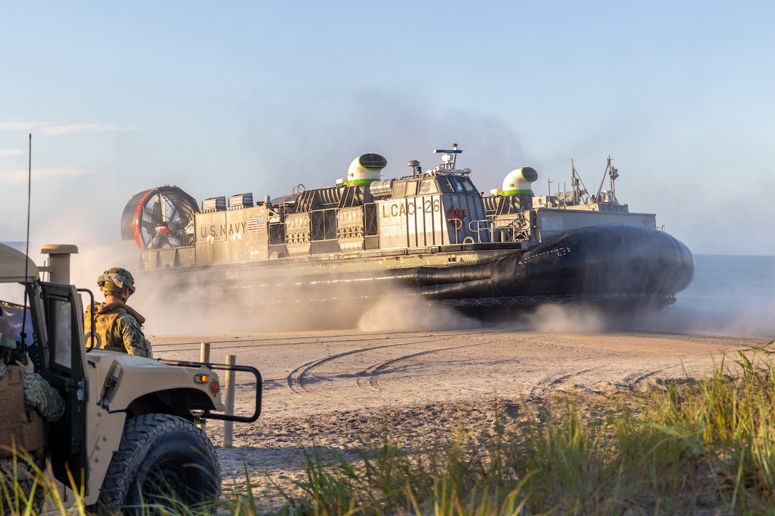 A U.S. Navy landing craft, air cushion with Assault Craft Unit 4 lands on Onslow Beach during a combined amphibious landing exercise as part of exercise UNITAS 2025 at Marine Corps Base Camp Lejeune, North Carolina, Sept. 25, 2025. UNITAS, which is Latin for “unity,” was conceived in 1959 and has taken place annually since first conducted in 1960. This marks the 66th iteration of the world’s longest running annual multinational maritime exercise. (U.S. Marine Corps photo by Lance Cpl. Jack Labrador)