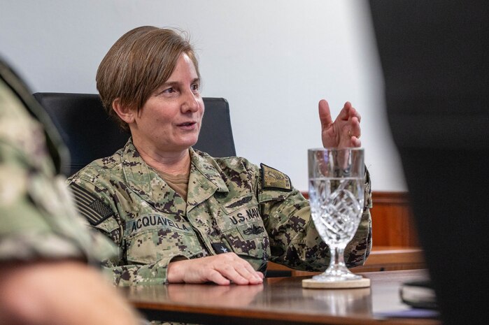 A member of leadership speaks to a room.