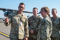 Members of leadership are briefed on the flightline during a tour