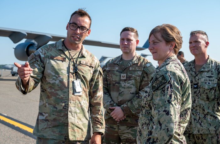 Members of leadership are briefed on the flightline during a tour