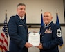Chief Master Sgt. Chris Tellis, right, outgoing senior enlisted leader for the 123rd Contingency Response Group, receives his certificate of retirement from Brig. Gen. Bruce Bancroft, Kentucky’s adjutant general for Air, during Tellis’ retirement ceremony at the Kentucky Air National Guard Base in Louisville Ky., June 7, 2025.