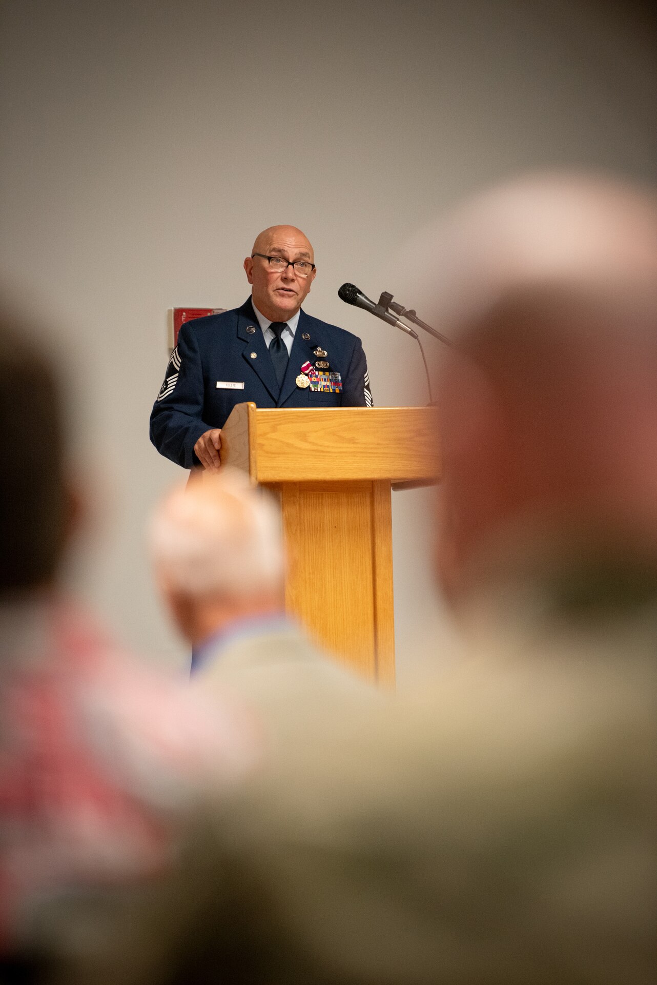 Chief Master Sgt. Chris Tellis, outgoing senior enlisted leader for the 123rd Contingency Response Group, speaks during his retirement ceremony at the Kentucky Air National Guard Base in Louisville, Ky., June 7, 2025.