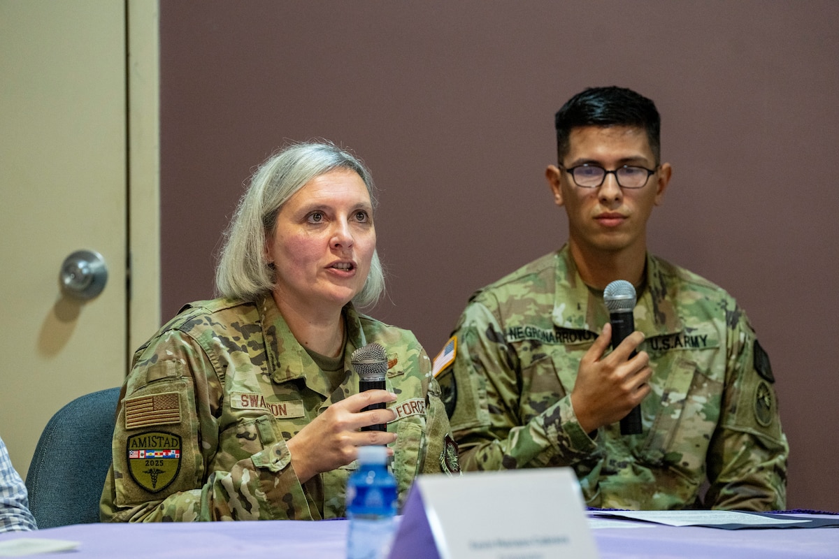 Image of two people talking.