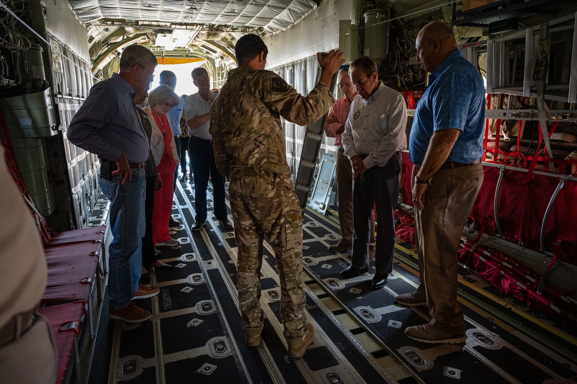 A group from the FDSC get a briefing inside of an MC-130J Commando II.