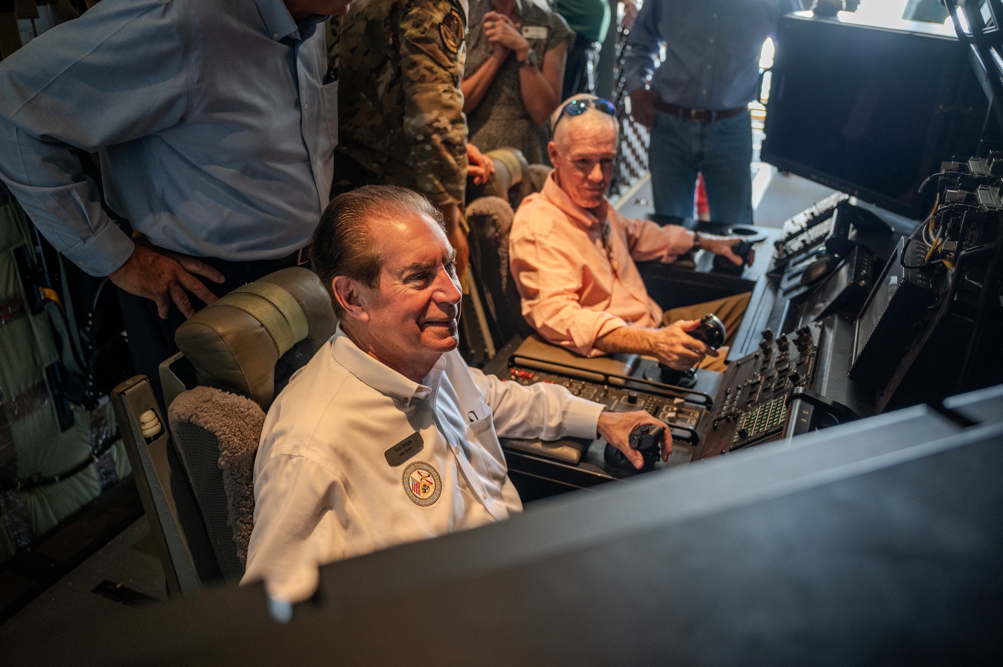 Sen. Tom Wright sits in a MOP (mission operator pallet) during a gunship tour.