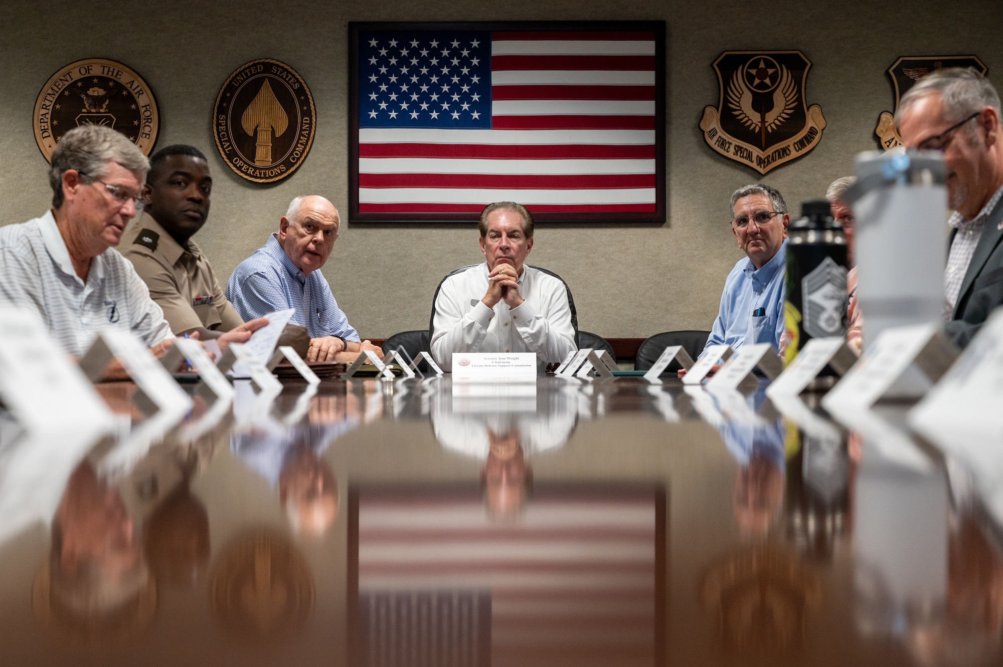 The FDSC at a conference table during a 1 SOW briefing.