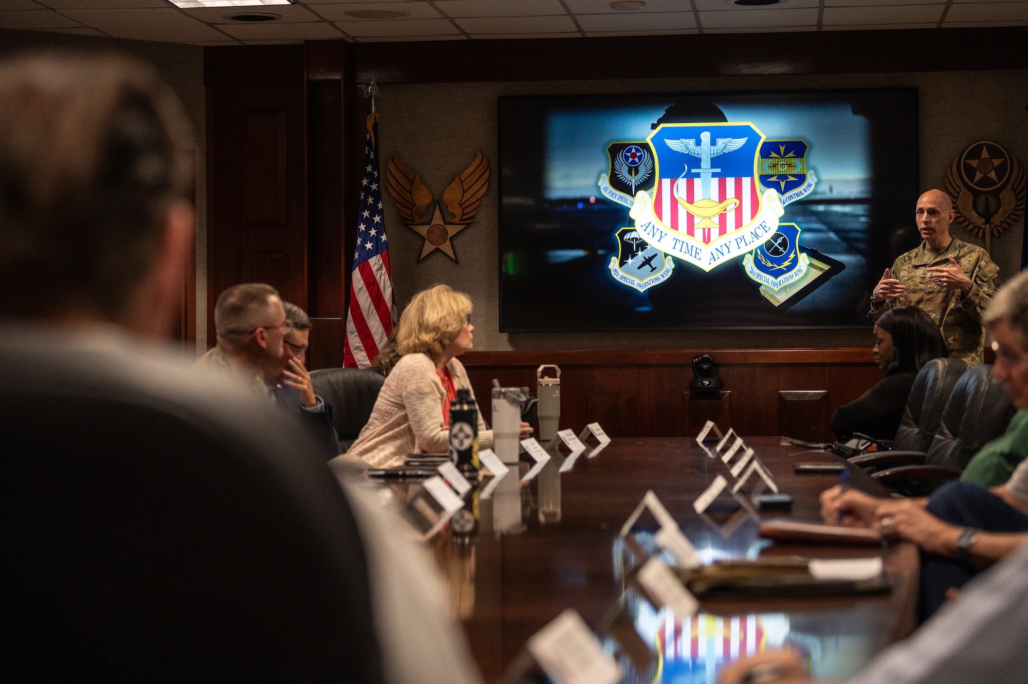 A military member briefing the FDSC in a conference room