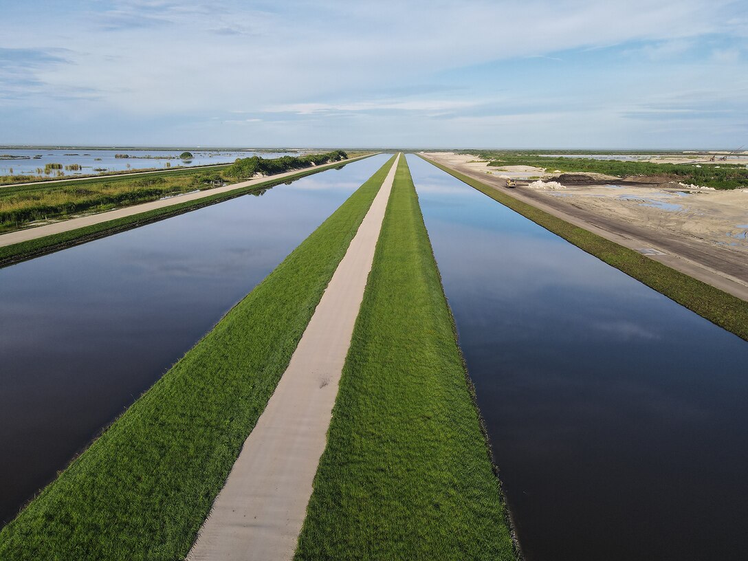 An aerial photo of the Everglades Agricultural Area (EAA) Contract 10. It is the 8-mile inflow/outflow canal (3,000 CFS) and 7-mile seepage canal / maintenance road (Northern Boundary of Reservoir).
The EAA is part of the Central Everglades Planning Project (CEPP) and the Comprehensive Everglades Restoration Plan (CERP). The project will set the foundation for restoring the central portion of the Everglades ecosystem and sending additional water south. CEPP EAA will capture water lost to tide and re-direct water flow south to the central Everglades, Everglades National Park, and Florida Bay. (U.S. Army Photo by Mark Rankin)
