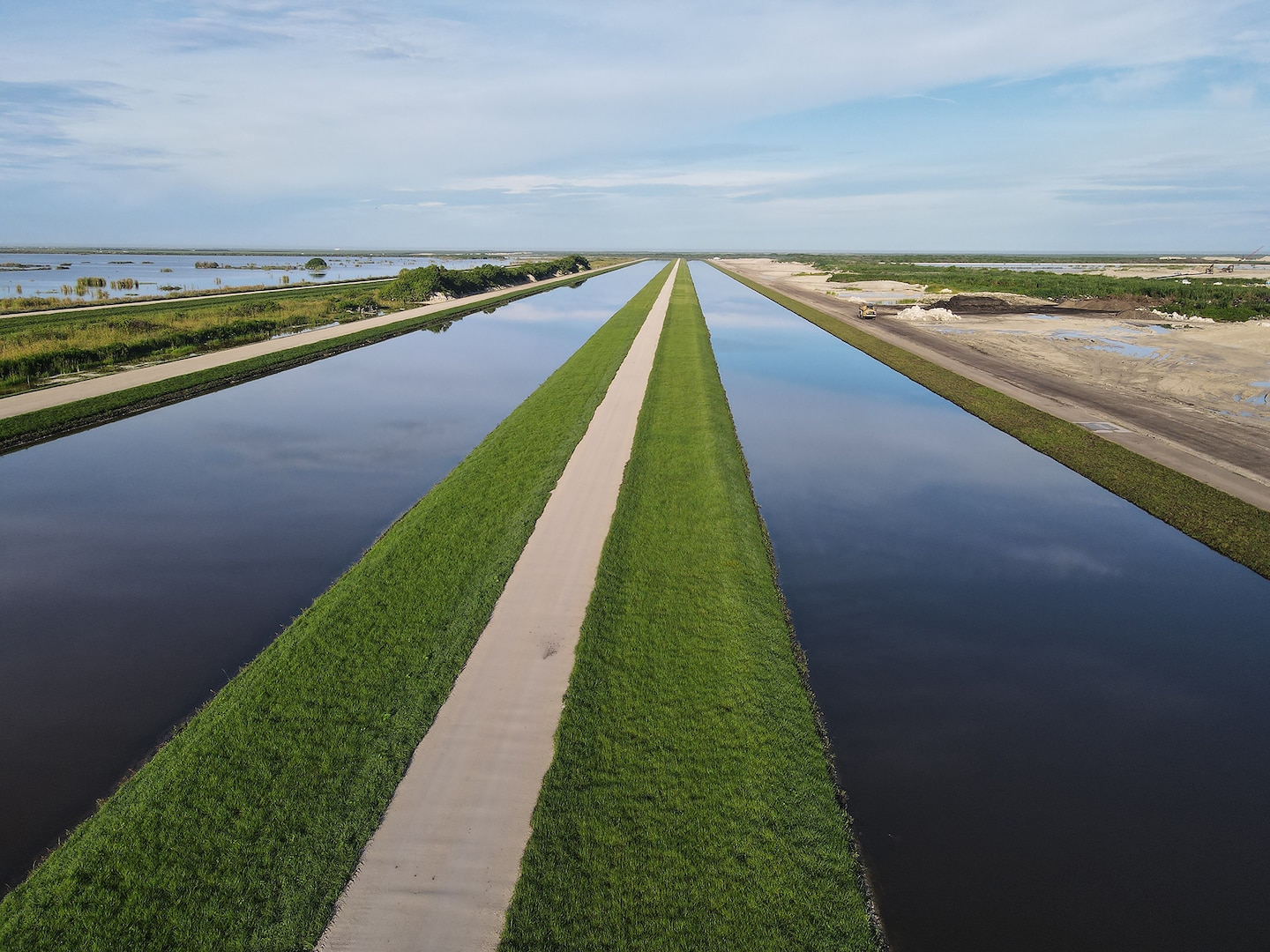An aerial photo of the Everglades Agricultural Area (EAA) Contract 10. It is the 8-mile inflow/outflow canal (3,000 CFS) and 7-mile seepage canal / maintenance road (Northern Boundary of Reservoir).
The EAA is part of the Central Everglades Planning Project (CEPP) and the Comprehensive Everglades Restoration Plan (CERP). The project will set the foundation for restoring the central portion of the Everglades ecosystem and sending additional water south. CEPP EAA will capture water lost to tide and re-direct water flow south to the central Everglades, Everglades National Park, and Florida Bay. (U.S. Army Photo by Mark Rankin)