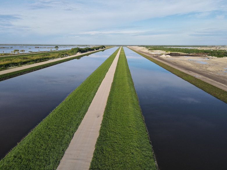 An aerial photo of the Everglades Agricultural Area (EAA) Contract 10. It is the 8-mile inflow/outflow canal (3,000 CFS) and 7-mile seepage canal / maintenance road (Northern Boundary of Reservoir).
The EAA is part of the Central Everglades Planning Project (CEPP) and the Comprehensive Everglades Restoration Plan (CERP). The project will set the foundation for restoring the central portion of the Everglades ecosystem and sending additional water south. CEPP EAA will capture water lost to tide and re-direct water flow south to the central Everglades, Everglades National Park, and Florida Bay. (U.S. Army Photo by Mark Rankin)