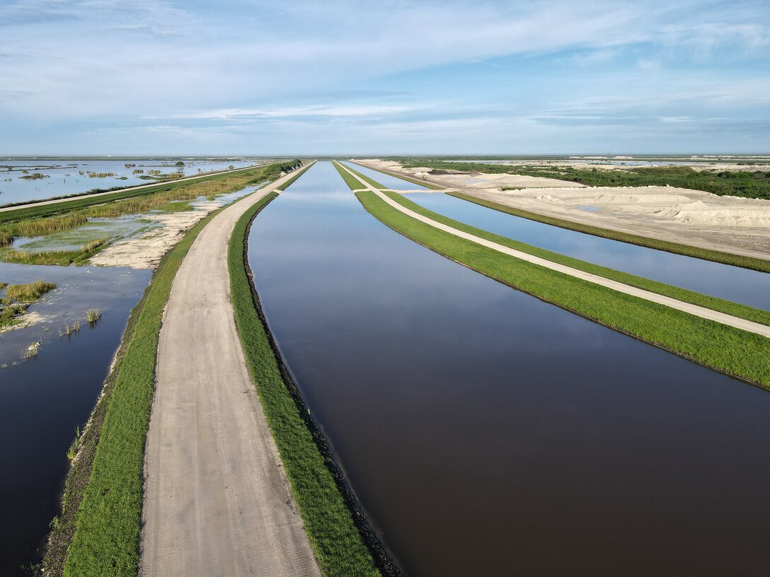An aerial photo of the Everglades Agricultural Area (EAA) Contract 10. It is the 8-mile inflow/outflow canal (3,000 CFS) and 7-mile seepage canal / maintenance road (Northern Boundary of Reservoir).
The EAA is part of the Central Everglades Planning Project (CEPP) and the Comprehensive Everglades Restoration Plan (CERP). The project will set the foundation for restoring the central portion of the Everglades ecosystem and sending additional water south. CEPP EAA will capture water lost to tide and re-direct water flow south to the central Everglades, Everglades National Park, and Florida Bay. (U.S. Army Photo by Mark Rankin)